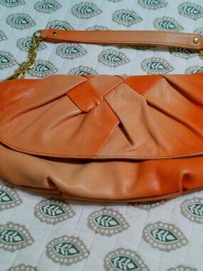 TWO TONE ORANGE LEATHER PURSE GOOD CONDITION BEBE